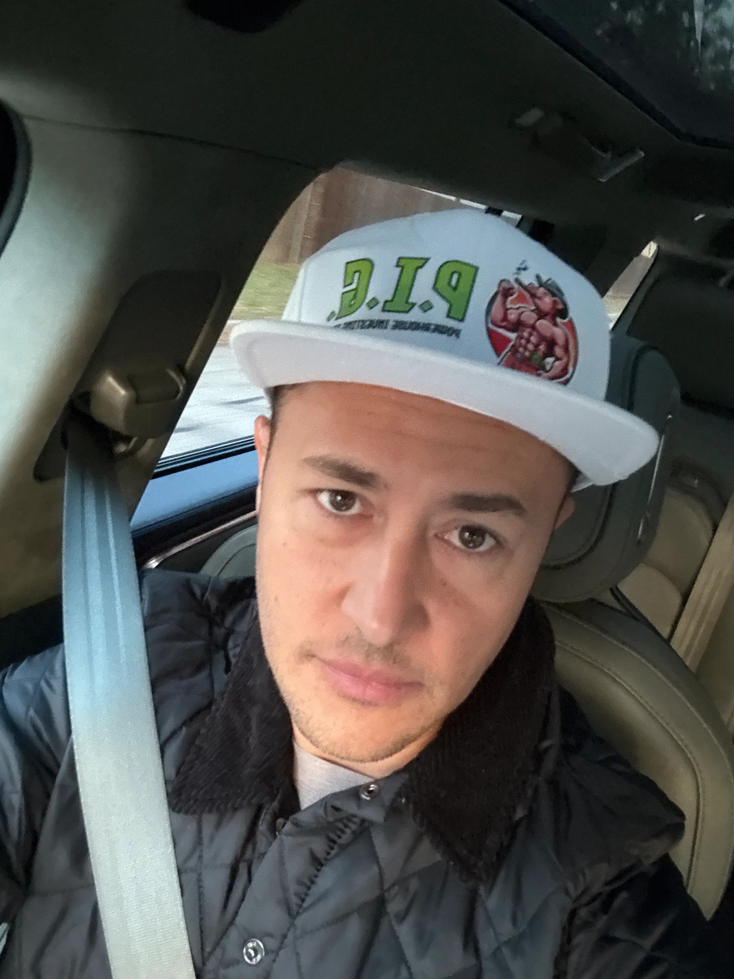 Member wearing a P.I.G. snapback
