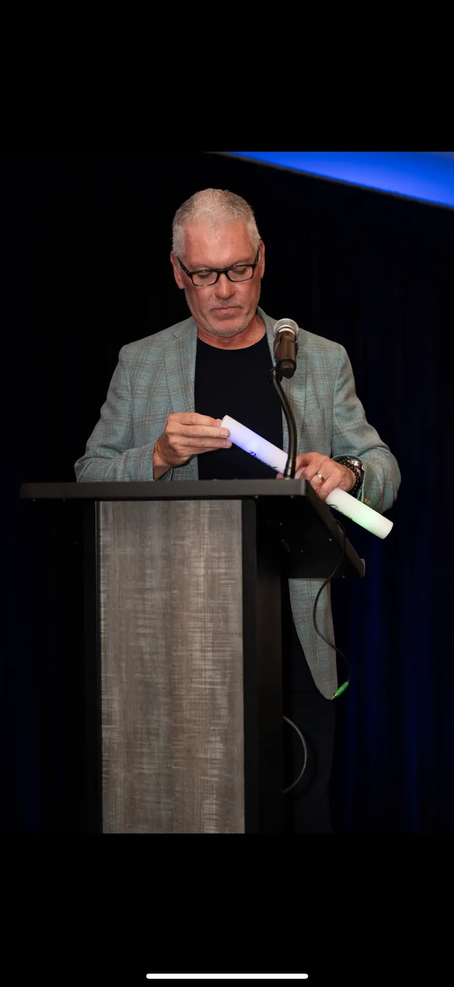 Speaker at the podium during a P.I.G. event