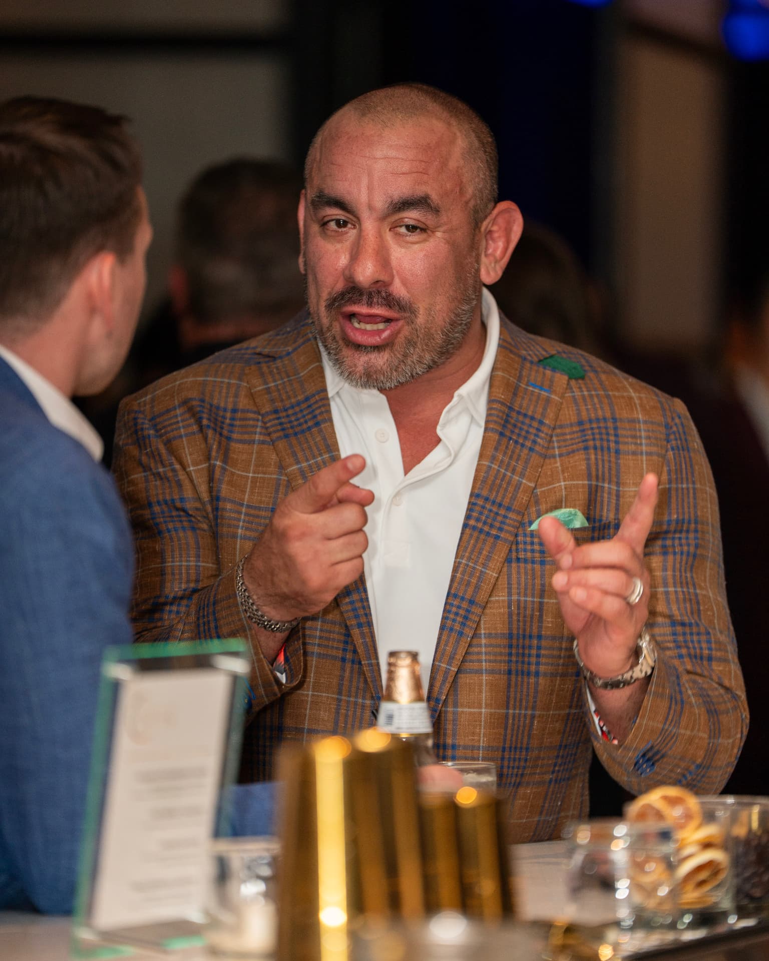 Members talking during a P.I.G. dinner event
